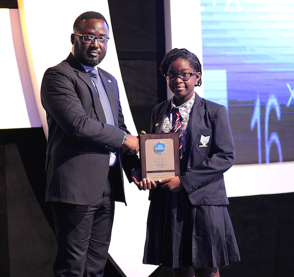 Faith Odunsi receives her recognition award from Marketing Manager of  Promasidor Nigeria Mr. Abiodun Ayodeji - Olori Supergal