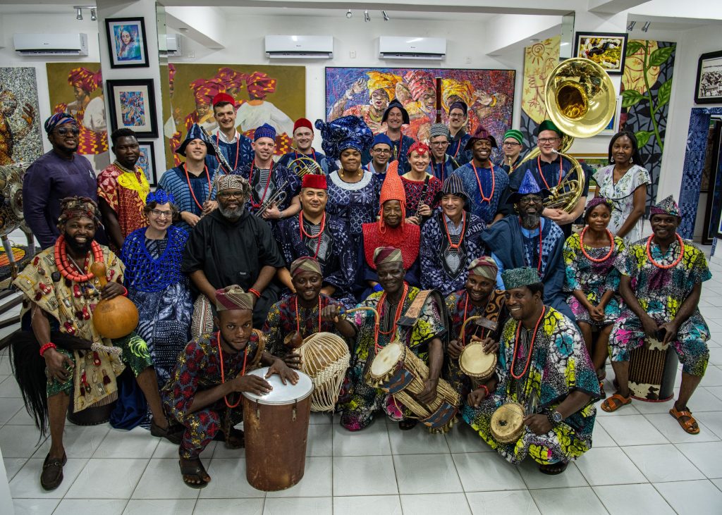Chief Dr. Nike Davies-Okundaye, center row and fifth from left, Jesse King Buga, center row and third from left, artists from the Nike Art Foundation and members of the U.S. Naval Forces Europe-Africa Band pose for a photo at the Nike Art Foundation in Lagos, Nigeria, Jan. 29, 2023, during exercise Obangame Express 2023.