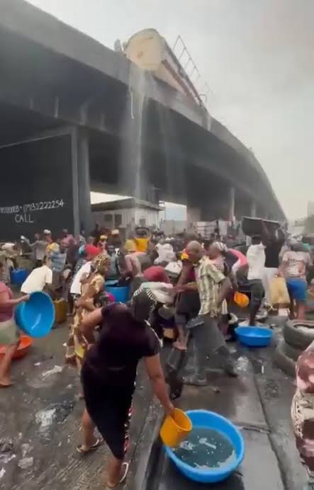 Tanker Overturns at Apapa Tincan Liverpool Bridge as Residents Rush to Scoop Fuel - OLORISUPERGAL MEDIA