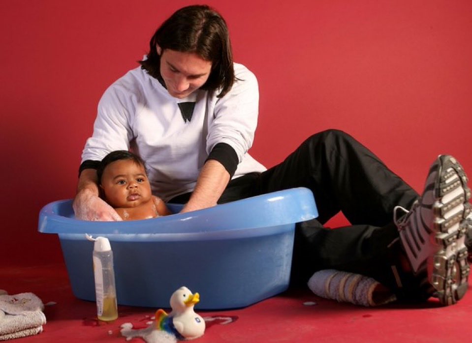 Lionel Messi bathing baby Lamine Yamal during a 2007 FC Barcelona Foundation and UNICEF charity photoshoot at Camp Nou.