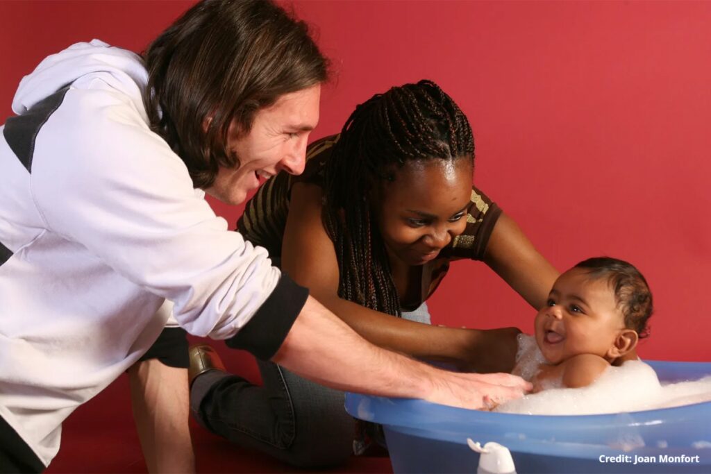 Lionel Messi with baby Lamine Yamal and his mother during a 2007 UNICEF charity photoshoot at Camp Nou.