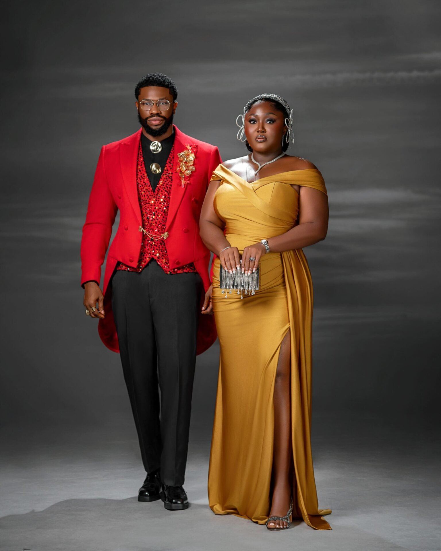 Stan and Blessing Nze Turn Heads in Red and Gold at the 19 Lagos Premiere